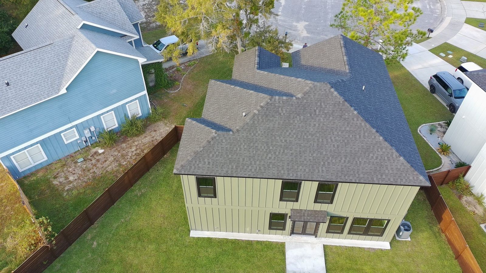 Drone roof inspection over a Gulf Coast neighborhood