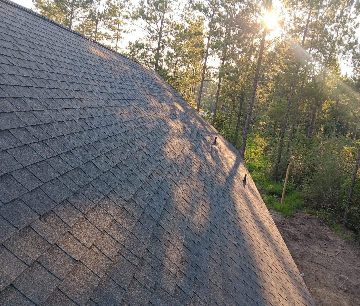 New roof installation on wooded Gulf Coast lot